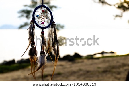 Native American Dreamcatcher on sea background, believe