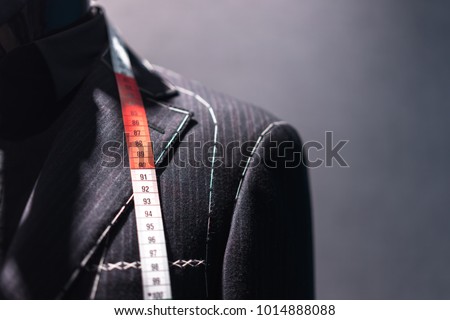 Mannequin with basted jacket by a tailor Royalty-Free Stock Photo #1014888088