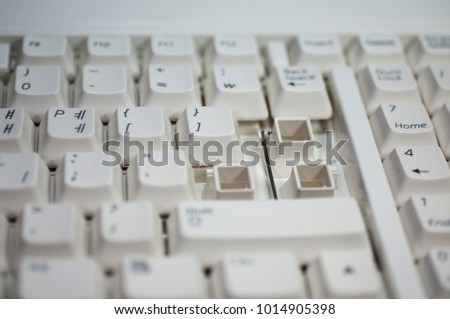 Computer keyboard with 'ENTER' key detached.