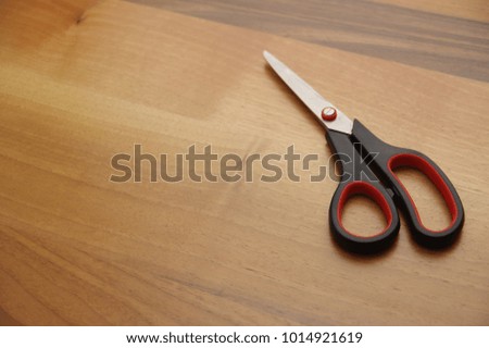 scissors on wooden table