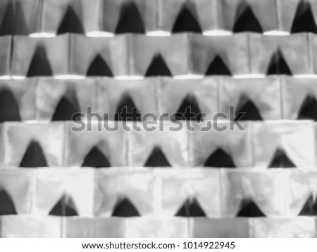 Blurred abstract background of cement block wall - black and white