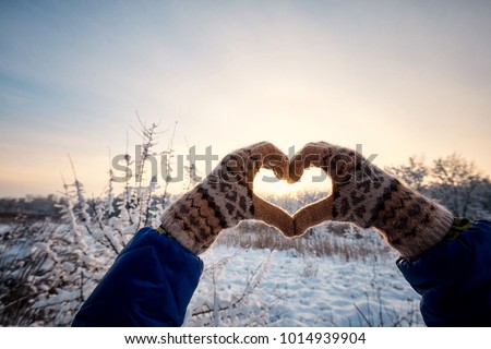 Walk the couple in love on a hike through the winter forest. Royalty-Free Stock Photo #1014939904