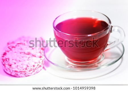Conceptual pic with healthy food. Cup with red tea in violet tone