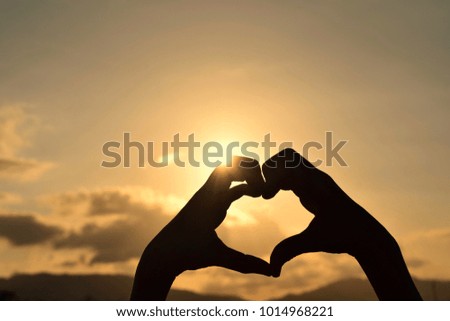Hand-made heart-shaped silhouette with sunset for Valentine's Day