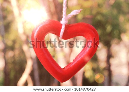 close-up image of red heart mobile hanging in valentine day