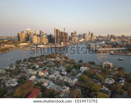 Beautiful aerial cityscape skyline on sunset evening, bird view of harbor in Sydney Australia