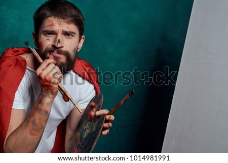  painter with brushes on a green background, art, creativity                              