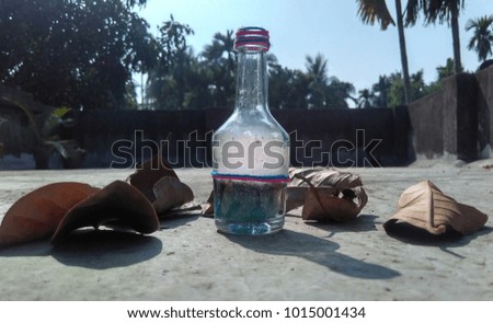 Date: 30/01/2018. This is a picture of a glass bottle filled with wax in the bottom and smoke upto the brim. Shot in a broad daylight. "Spirits Let Free"