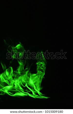 abstract Green fire flames on black background