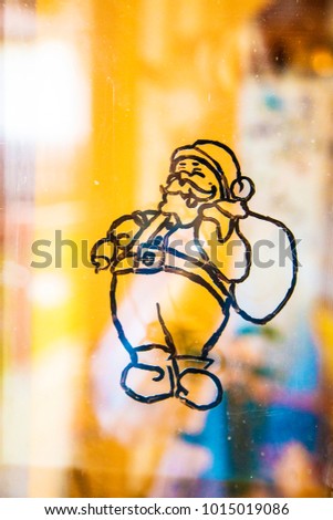 Drawn santa clause on the glass ,christmas decoration