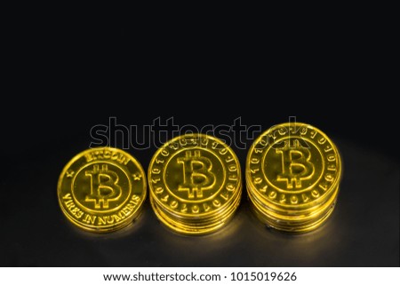 Gold Bitcoin on black background. Concept electronic money in future.
