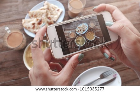 Food photo of indian food on wooden table for social networks