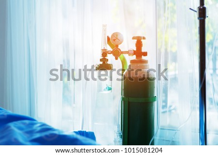 Oxygen tank beside patient bed in hospital. Royalty-Free Stock Photo #1015081204