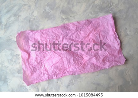 Pink paper on the textured background.