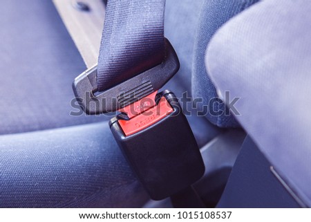 Close up portrait of a driver hand fastening seatbelt in a car Royalty-Free Stock Photo #1015108537