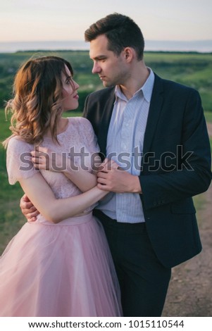 Young couple in love at sunset