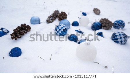 several hanukkah ornaments laying in the snow