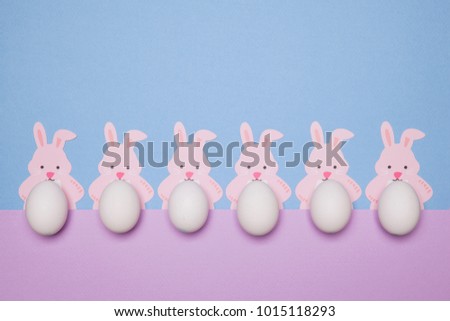 six easter bunnys on pastel background