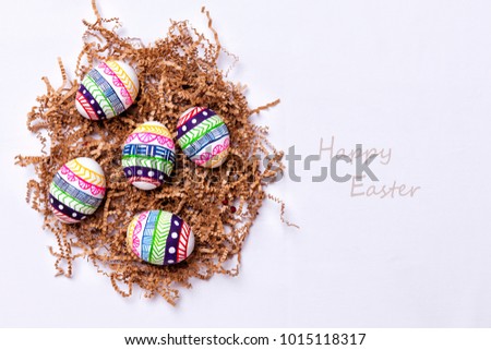 painted easter eggs in nest_with text (horizontal photo)
