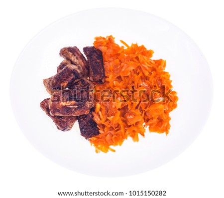 Stewed cabbage with fried ribs. Studio Photo