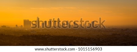 Panoramic view of Los Angeles skyline at sunrise, viewed from Griffith observatory, California, USA