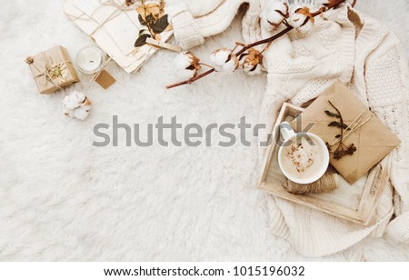 Winter cozy background with cup of coffee, warm sweater and old letters. Flat lay for bloggers Royalty-Free Stock Photo #1015196032