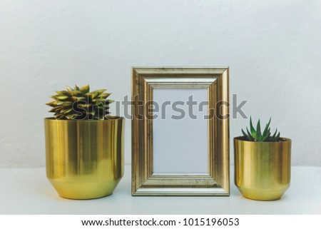 Houseplants with blank small chalkboard in front of white brick wall, mockup concept 
