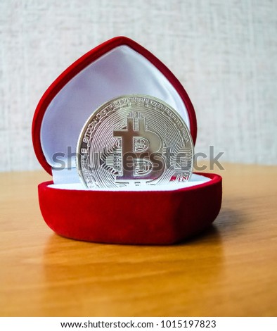 Bitcoin (BTC) inside red heart box for expensive rings or jewelry.