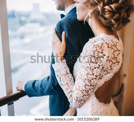 wedding couple, the bride holding the groom by the shoulder