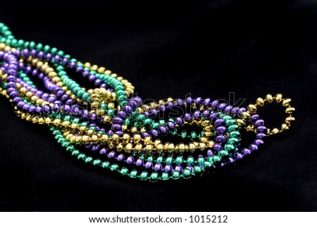 Mardi gras beads on black