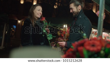 Beautiful young couple on a night date.
