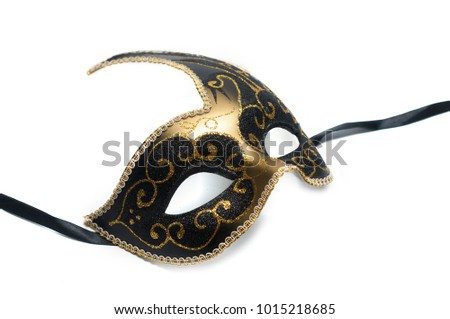 Black and gold venetian mask with swand decoration isolated