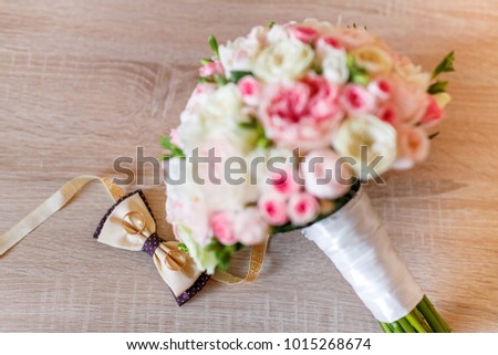 Wedding bouquet of light roses. Beautiful wedding flowers. Bouquet of flowers for the bride