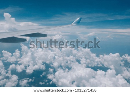 Royalty high quality free stock image of aerial view from plane windows. Beautiful view with white cloud and blue sky background from plane windows
