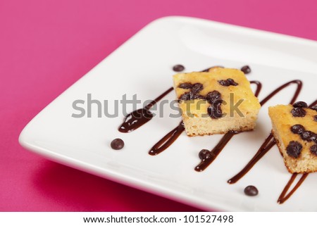 Gluten free chocolate chip cake on a white plate