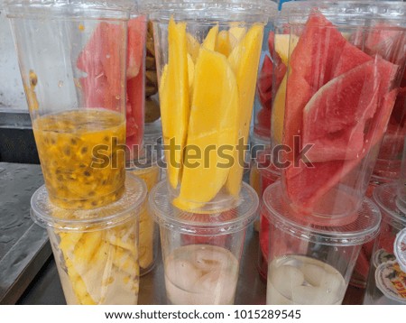 The many type of fruits in the glass for make smoothy drink