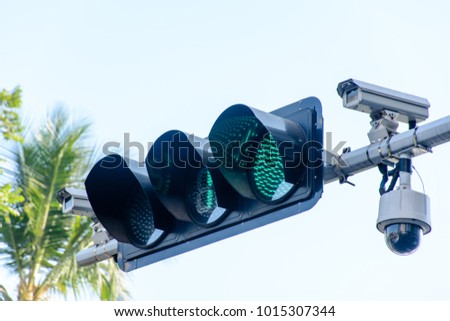 photo of traffic light and cctv camera