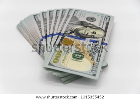 a stack of us 100 dollars cash with white background