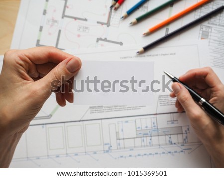 Business card on the background of an architectural project. The concept for the business project.