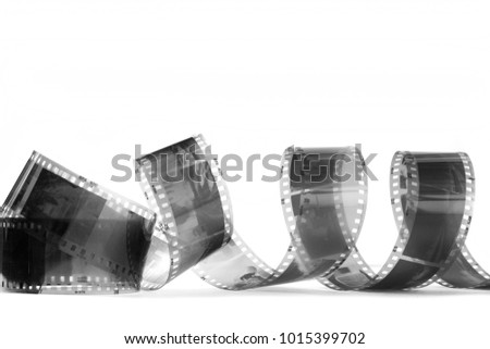 spiral of black and white negative film on white background, isolated