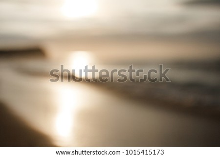 portrait of blur picture of beach at golden hour