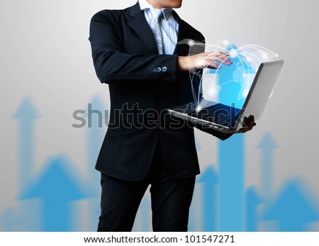business man with laptop and growth a graph