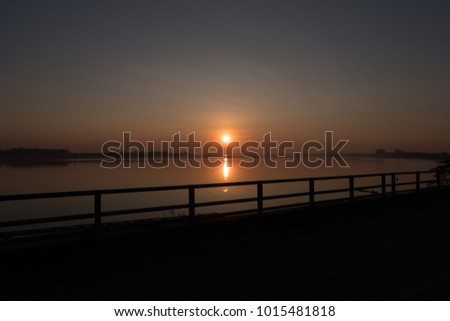 This picture take a silhouette bridge between sunrising from nong khai Thailand.