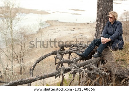 middle aged woman relaxing in the forest