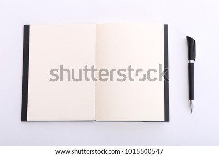 Business, education. Workplace, notepad for notes and pen. White background.