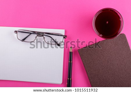 Workspace and office stuff on a pink background. Copy space for text or product display montage.