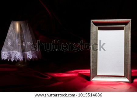 blank mourning frame, with goldene chalice on deep red background