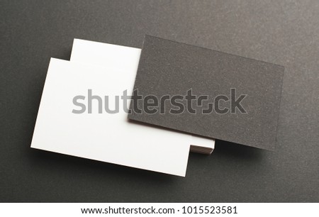 Black and white business card on black background. Mockup.