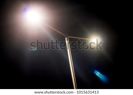 Close up of street light isolated on black.