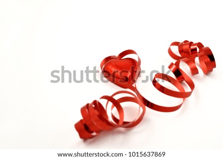 Red ribbon with a chocolate heart stock images. Red Ribbon Heart on white background. Red ribbon in heart shape. Valentines Day concept